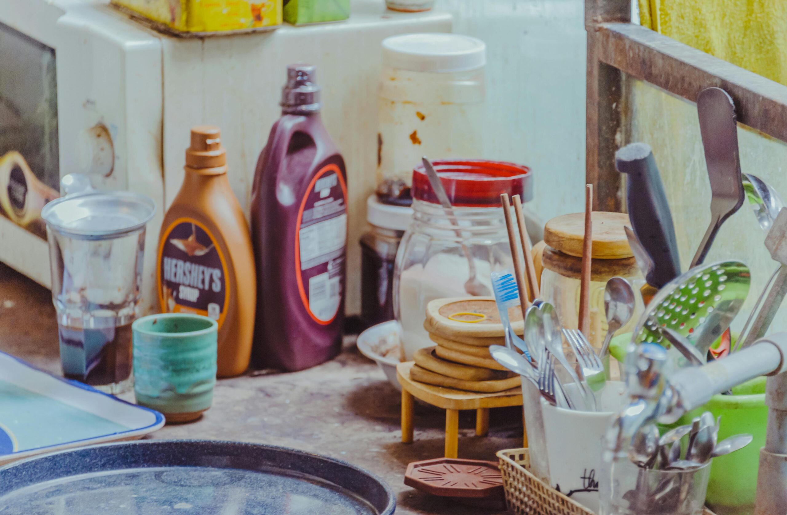 A well-equipped kitchen counter with utensils, jars, and condiment bottles.
Kitchen Storage Solutions